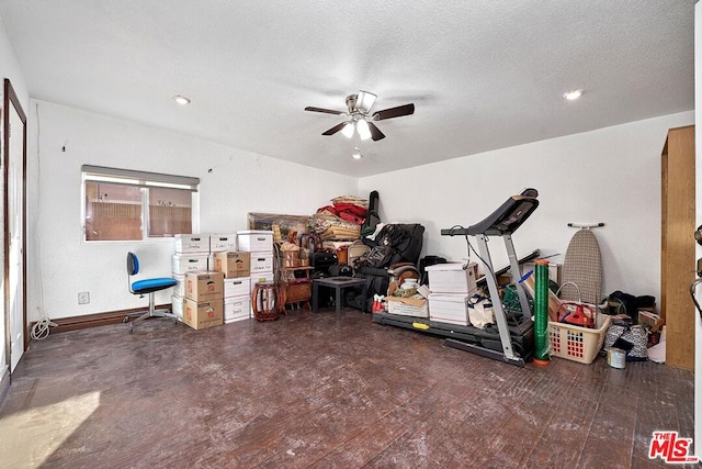 miscellaneous room featuring ceiling fan and a textured ceiling