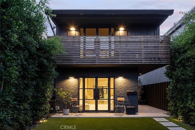 335 Flint Ave, Long Beach, CA 90814 - back of house featuring a balcony and stone siding