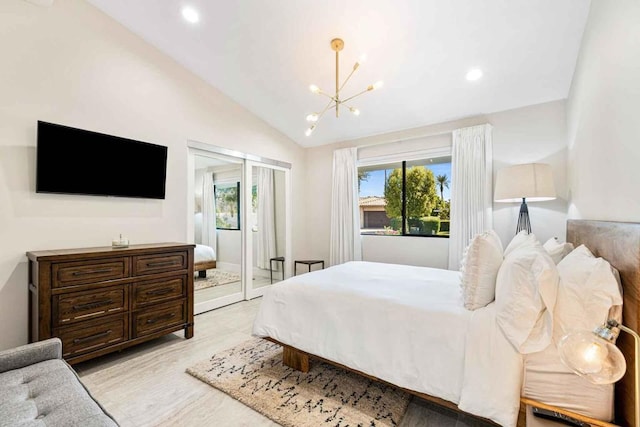 bedroom with a chandelier and vaulted ceiling