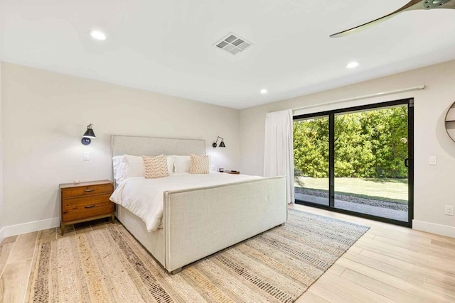 bedroom featuring access to exterior and light hardwood / wood-style flooring