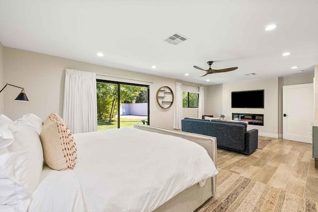 bedroom with ceiling fan and access to exterior