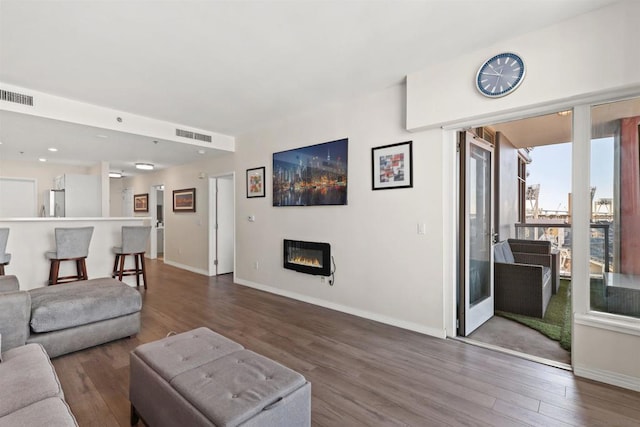 living room with dark hardwood / wood-style floors