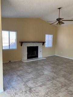 unfurnished living room featuring ceiling fan and vaulted ceiling