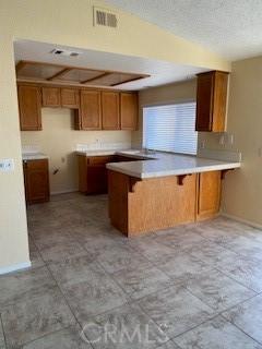 kitchen with kitchen peninsula and a kitchen breakfast bar