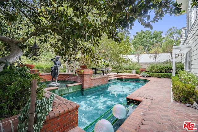 view of pool featuring a patio area