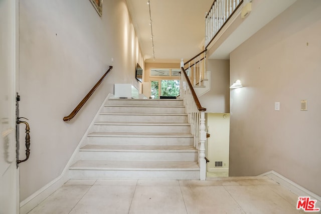 stairway with a high ceiling