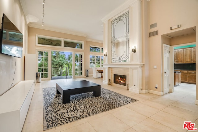 tiled living room featuring a premium fireplace and ornamental molding