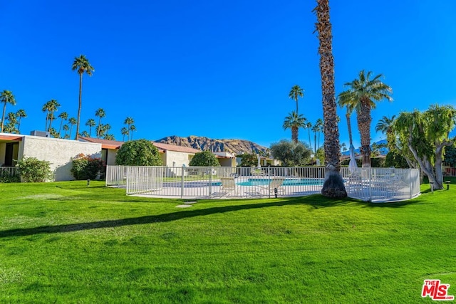 view of yard featuring a community pool