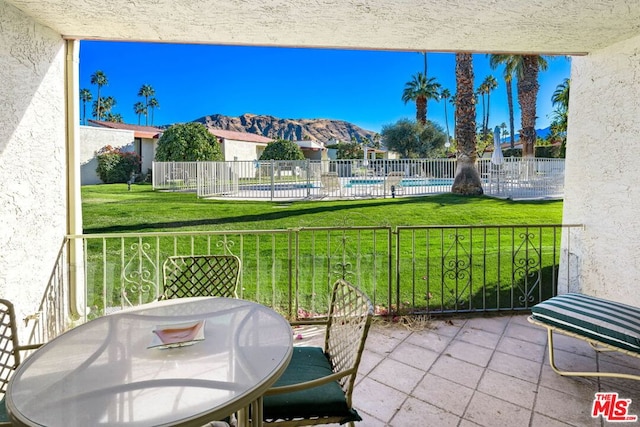 exterior space featuring a mountain view and a patio