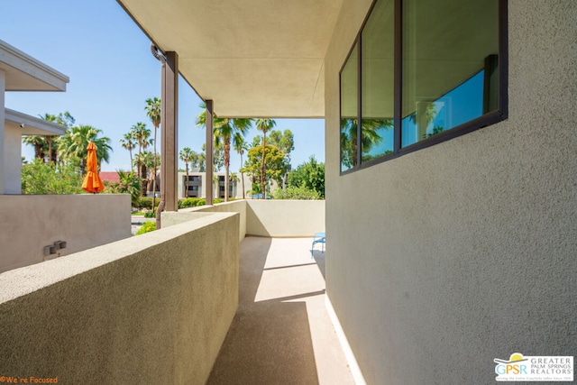 view of patio featuring a balcony