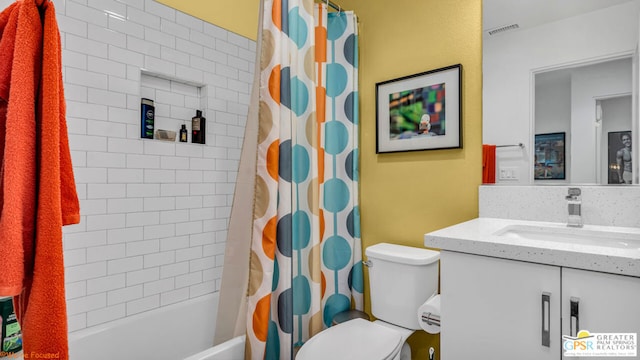 full bathroom with shower / tub combo, vanity, and toilet