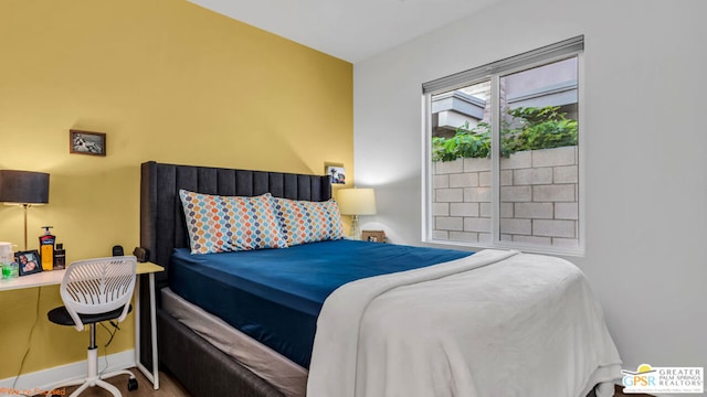 bedroom with wood-type flooring