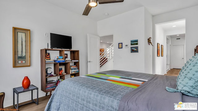 bedroom with ceiling fan and light hardwood / wood-style flooring