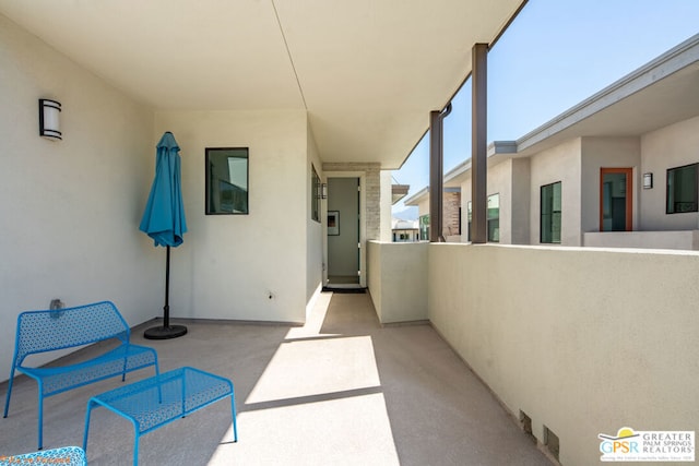 view of patio / terrace with a balcony