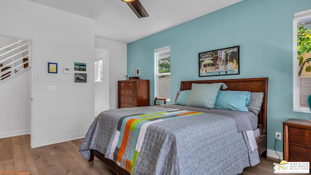 bedroom with ceiling fan and light wood-type flooring