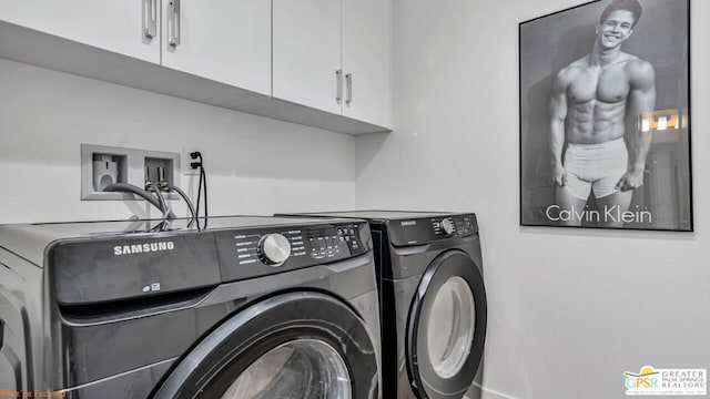 laundry room with cabinets and independent washer and dryer