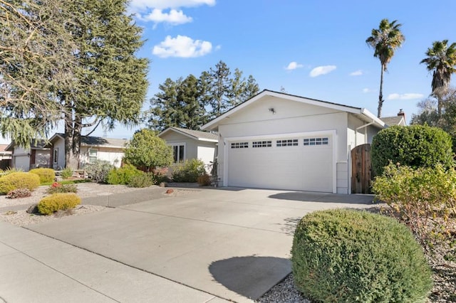 single story home featuring a garage