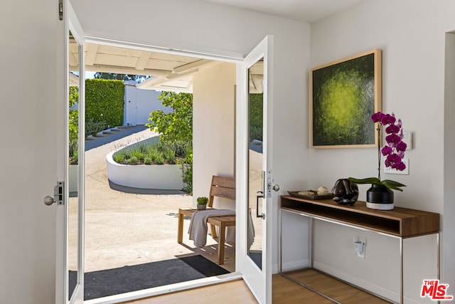 doorway to outside with hardwood / wood-style floors