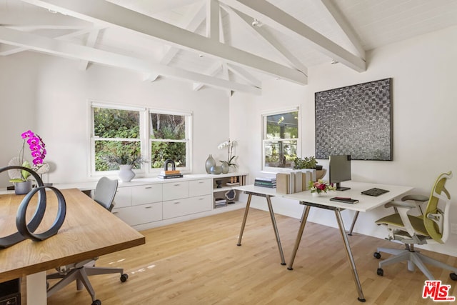 office area with vaulted ceiling with beams, plenty of natural light, and light wood-type flooring