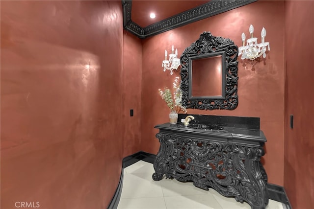 bathroom with tile patterned floors and crown molding