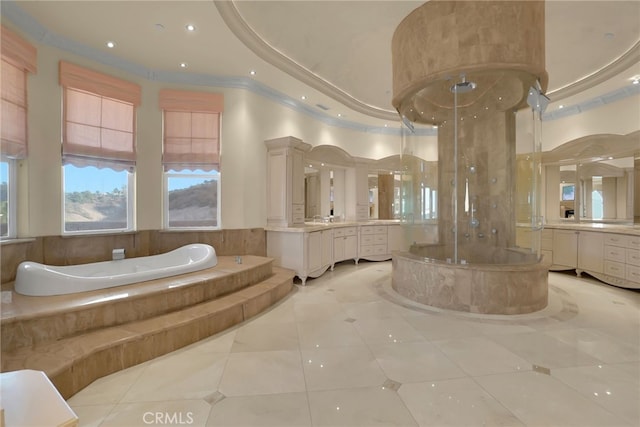 bathroom featuring a bath, vanity, and tile patterned floors