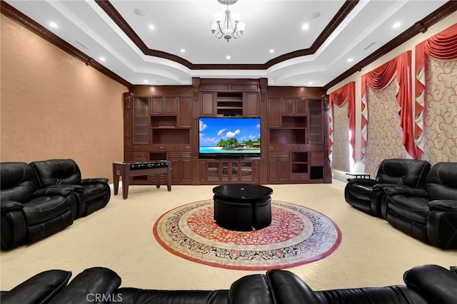 carpeted cinema featuring an inviting chandelier and ornamental molding