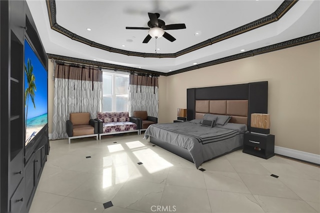 bedroom featuring ceiling fan, a raised ceiling, ornamental molding, and light tile patterned floors