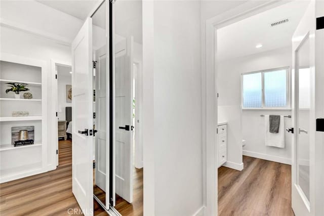 corridor featuring hardwood / wood-style flooring