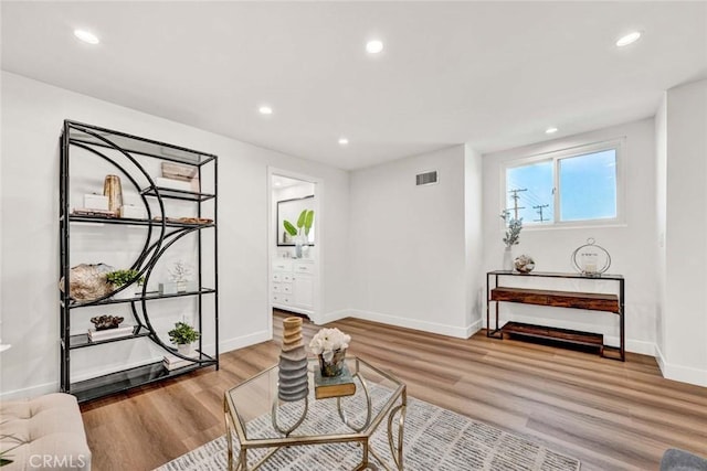 sitting room with light hardwood / wood-style floors