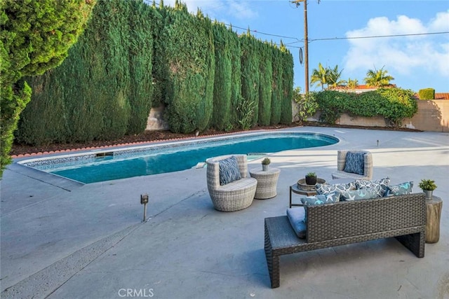 view of swimming pool with a patio