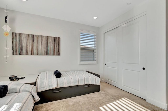 carpeted bedroom featuring a closet