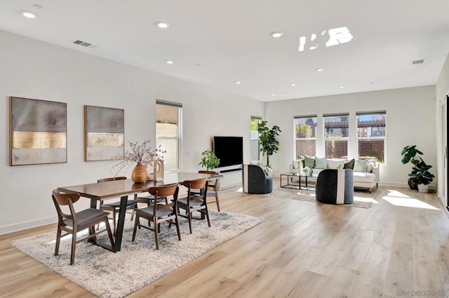 dining room with light wood-type flooring