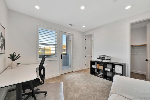 home office with light colored carpet