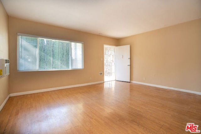 spare room with light hardwood / wood-style floors