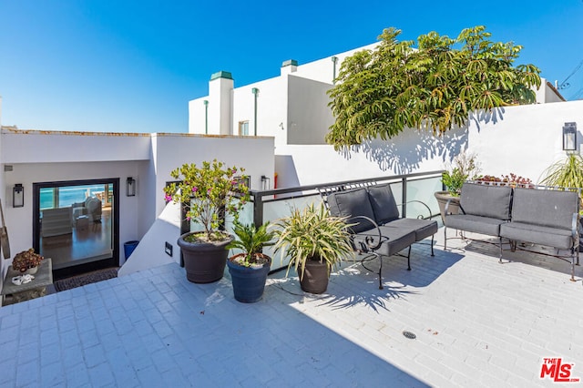 view of patio with a deck and an outdoor hangout area