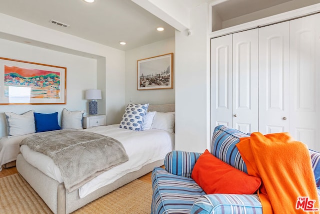 bedroom featuring a closet and hardwood / wood-style floors