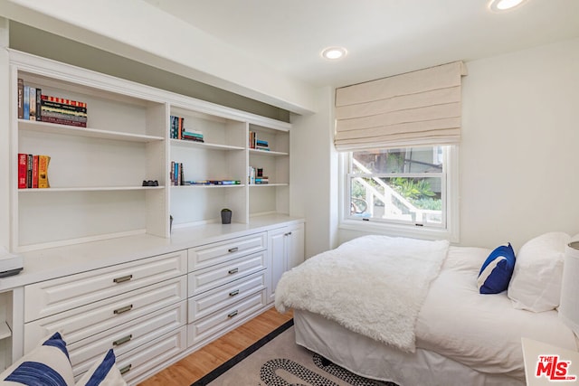 bedroom featuring wood-type flooring