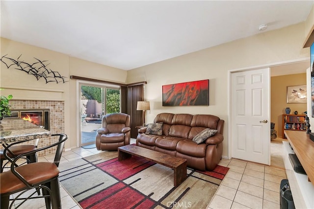 tiled living room with a tile fireplace