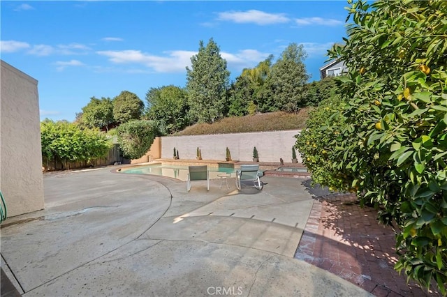 view of patio featuring a fenced in pool