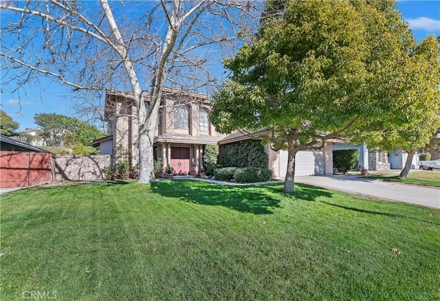 view of front of property with fence, driveway, and a front yard