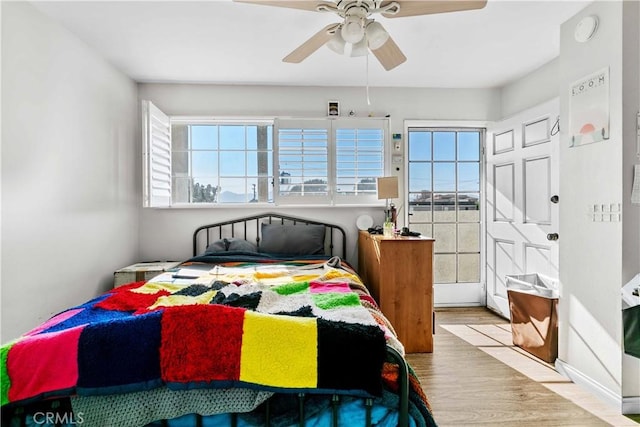 bedroom featuring ceiling fan and light wood-type flooring