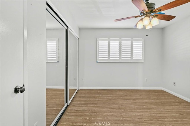 unfurnished bedroom with a closet, ceiling fan, and light hardwood / wood-style floors