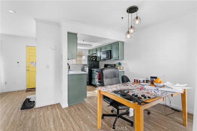 dining space featuring crown molding and light wood-type flooring