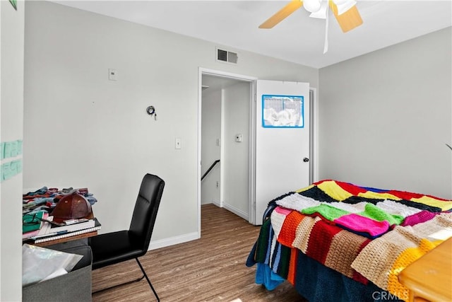 bedroom featuring wood-type flooring and ceiling fan