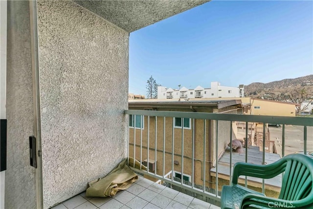 balcony featuring a mountain view