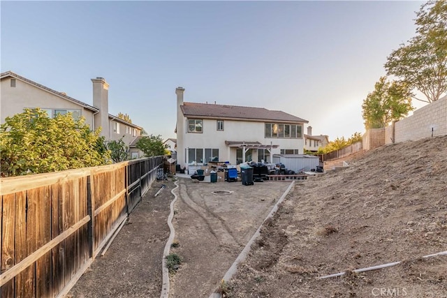 rear view of property featuring a pergola