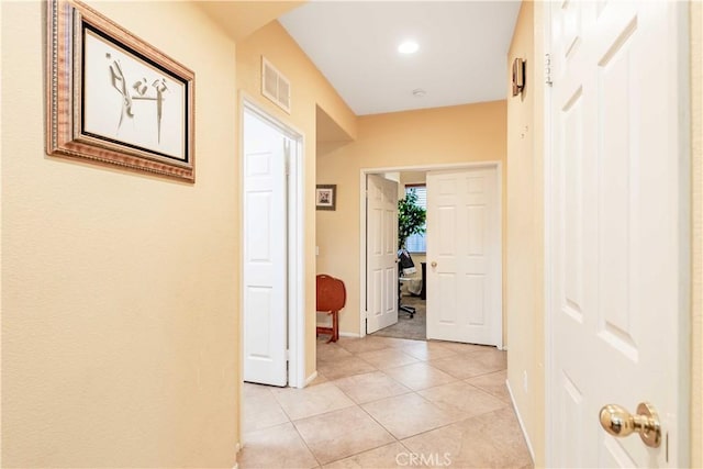 hallway with light tile patterned flooring