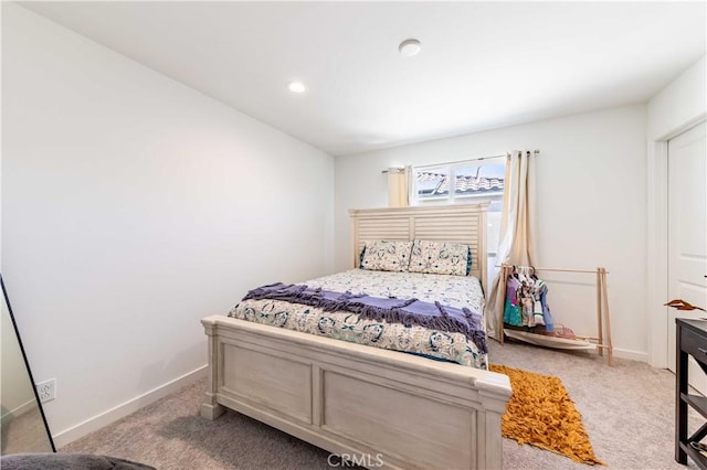 bedroom with light colored carpet