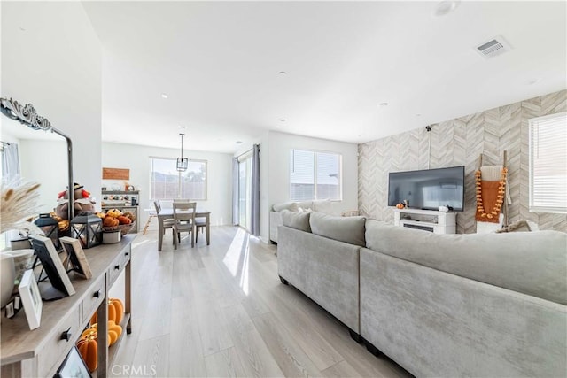 living room with light hardwood / wood-style floors