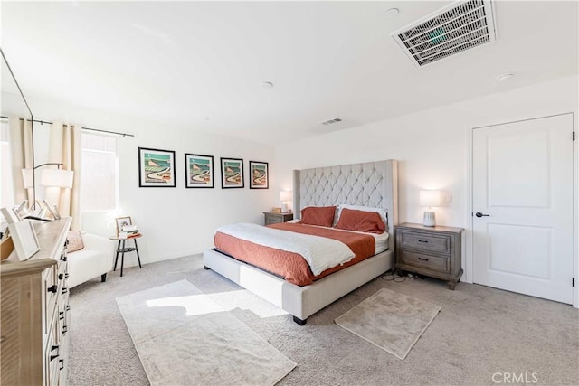 bedroom featuring light colored carpet